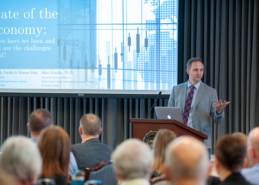 Attendees listen as a speaker presents at Smart Money Week